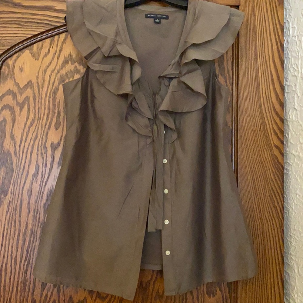 Ruffle neck button down top.